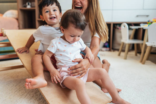 istock Mother playing with toddlers 1430737423