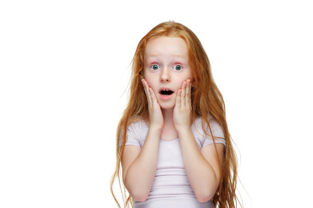istock Amazed little girl holding hands on her cheeks 1430737433
