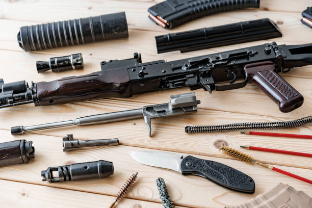 istock Disassembled rifle with cleaning tools on table of weapons workshop 1430737820