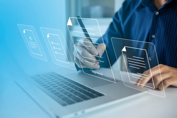istock Businessman, work from home, handling documents, E-signing, signing digital contracts electronic signing electronic signature through internet technology document data management smart contract 1430740282