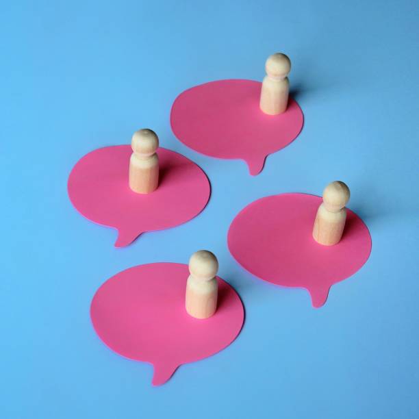 istock Wooden dolls on speech bubble. 1430742354