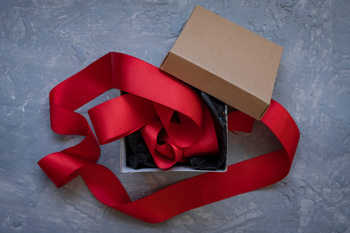 Open Gift Box Tied With Red Ribbon