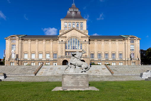 Szczecin, Poland - September 16, 2022: Main mach of National Museum of Szczecin located on Chrobry Embankment. Sculpture Hercules fighting a centaur by Ludwig Manzel in front of building