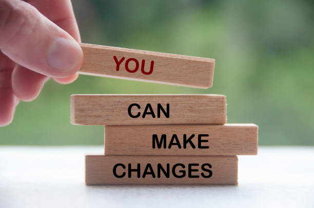 istock Hand stacking wooden block with text You Can Make Changes. Inspirational concept 1430750856