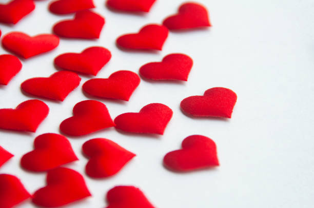 istock Red heart shapes on white background customizable with space for text. Copy space and relationship concept 1430750892