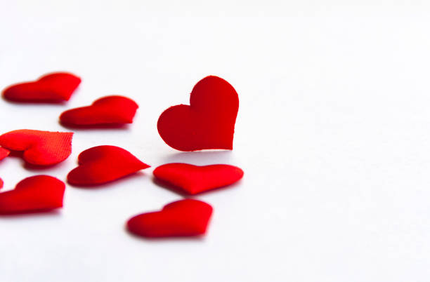 istock Red heart shapes on white background customizable with space for text. Copy space and love concept 1430750904
