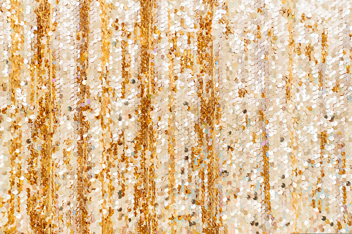 a curtain with shiny sequins. decor for a holiday or photo shoot. glitter and shimmer. festive atmosphere. decor element. background.
