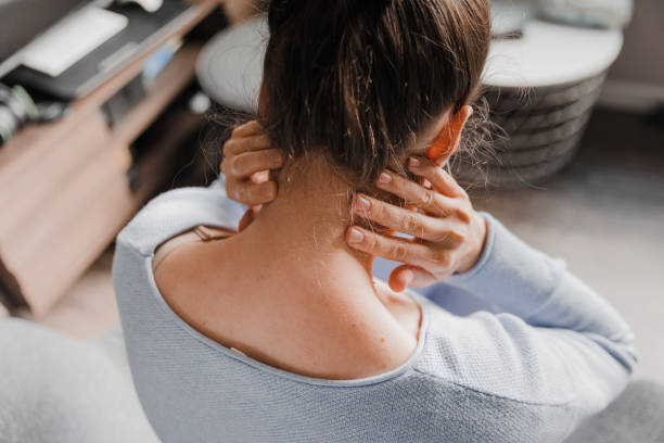 istock Woman massaging her stiff neck 1430757033