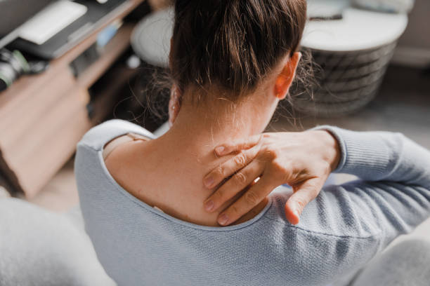 istock Woman massaging her stiff neck 1430757074