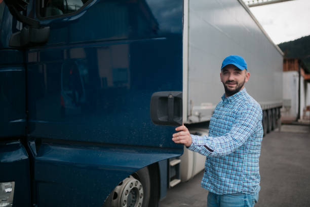 istock Male trucker entering his truck 1430761911