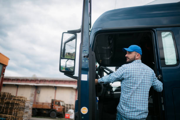 istock Male trucker entering his truck 1430761939