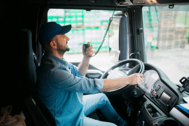 Driver using a radio in his truck stock photo