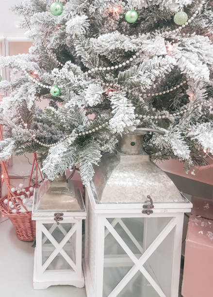 istock Beautiful composition with vintage Christmas lantern under the Christmas tree with silver branches, vertical 1430763104