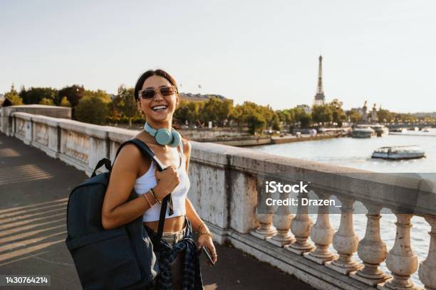Young Traveler Enjoying City Break In Paris In Summer Carrying Backpack And Smiling Stock Photo - Download Image Now