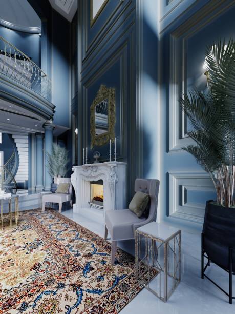 istock Fireplace area with a white stone fireplace with two leather chairs and large houseplants in a classic dark blue interior. 1430765084