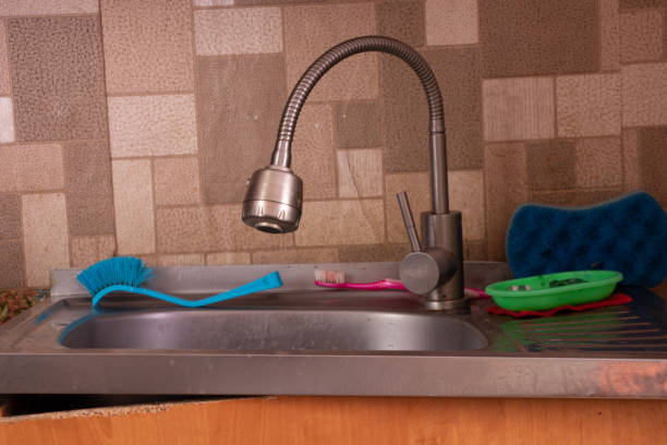 istock Soviet apartment, kitchen sink in the kitchen, broken bedside table, kitchen sink and faucet, apartment without 1430765492