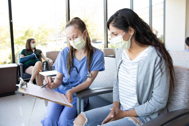 istock Doctor shows female patient some paperwork 1430765799