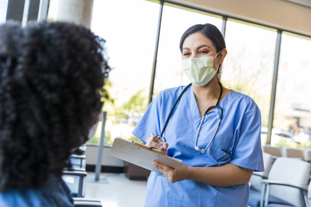 istock Nurse approaches the female patient 1430765919