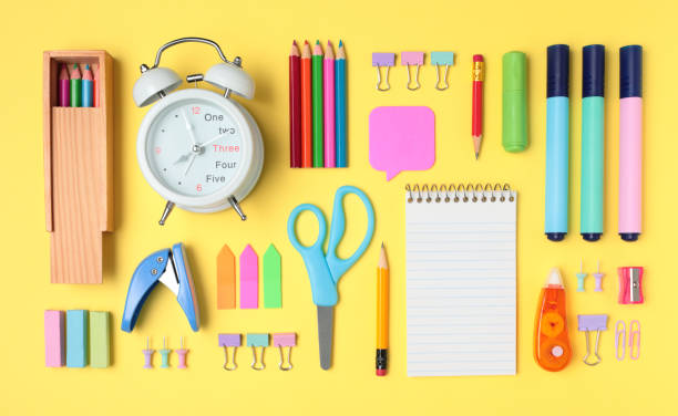 istock School and office supplies on yellow background, mock-up top view 1430766475