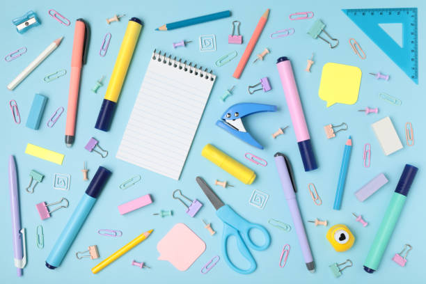 istock School and office supplies on blue background, mock-up top view 1430766534
