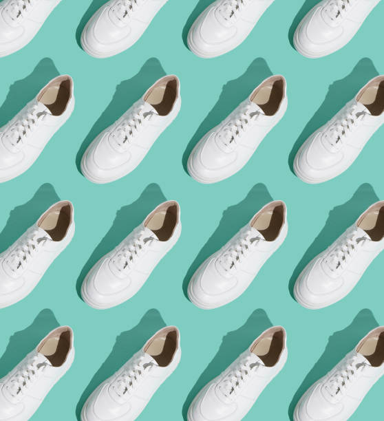 istock White sneakers pattern on background. The shoes are comfortable and casual. Background for a shoe store. 1430766640
