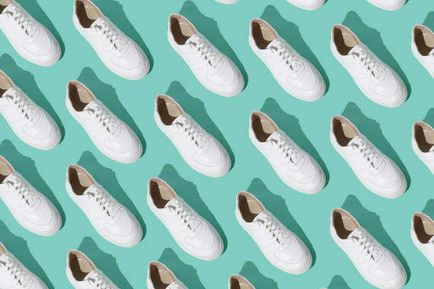 istock White sneakers pattern on background. The shoes are comfortable and casual. Background for a shoe store. 1430766642