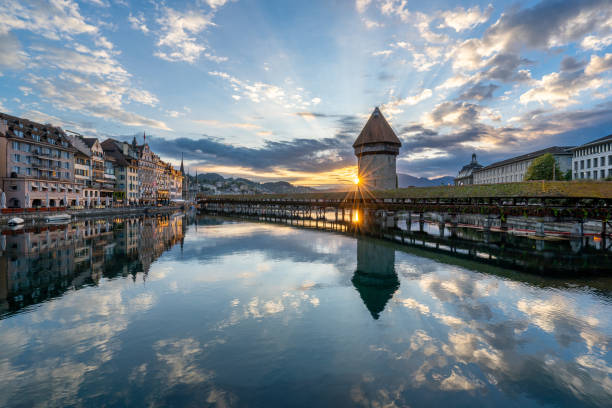 Vibrant Sunrise Over Chapel Bridge in Lucerne, Switzerland's Downton District and the Reuss River stock photo