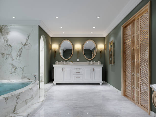 istock Bathroom with green walls and white double washbasin with two oval mirrors. 1430767703