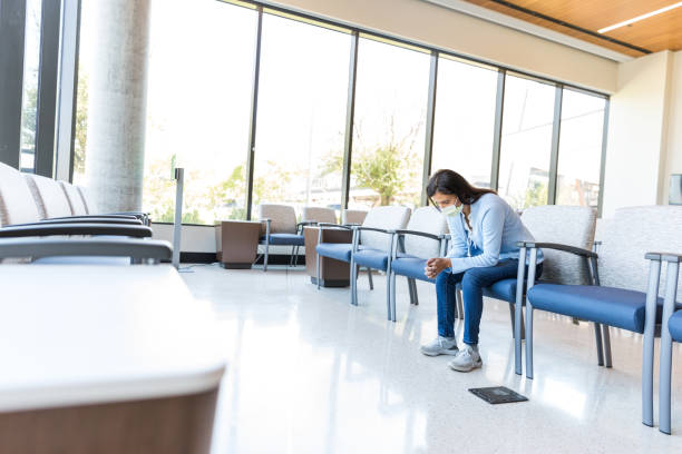 istock Female patient leans forward in her chair 1430769029