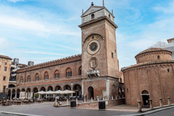 The Square of Erbe in Mantua with historical buildings and a beautiful clock tower stock photo