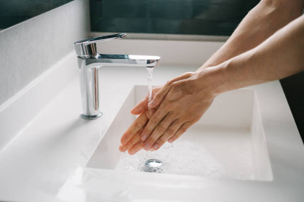 istock Man washing hands in the bathroom 1430770848