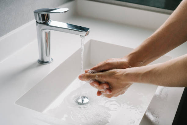 istock Man washing hands in the bathroom 1430770850