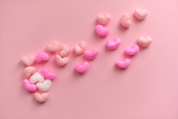 istock Valentine's Day concept with red hearts on pink background 1430770935