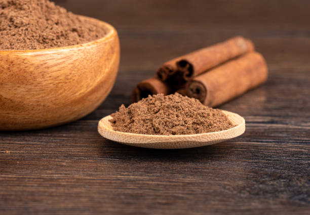 istock Selective focus on ground cinnamon on a wooden background. 1430774198