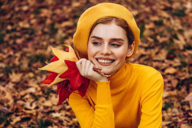 Beautiful woman enjoying autumn