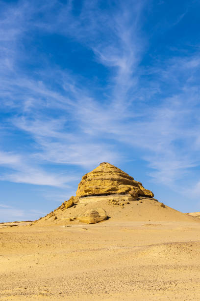 Eroded bluff along the interpretive trail at Wadi el-Hitan paleontological site.