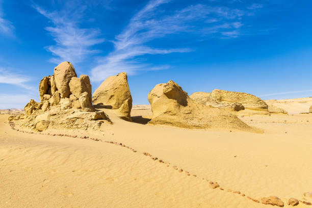 istock Eroded rocks along the interpretive trail at Wadi el-Hitan paleontological site. 1430781503