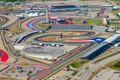 Austin, United States - September 29, 2022:  Aerial view of the Circuit of the Americas Formula One  race track located just outside of downtown Austin, Texas shot from an altitude of about 1200 feet from an orbiting helicopter.