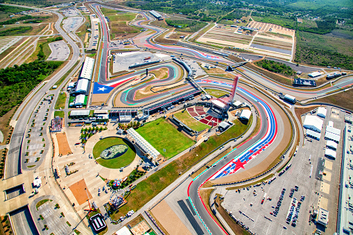 Austin, United States - September 29, 2022:  Aerial view of the Circuit of the Americas Formula One  race track located just outside of downtown Austin, Texas shot from an altitude of about 1200 feet from an orbiting helicopter.