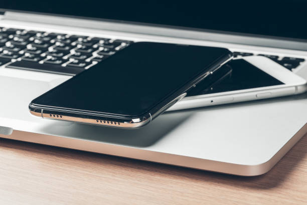 istock Laptop and mobile phone on the table. Workspace concept. 1430783274