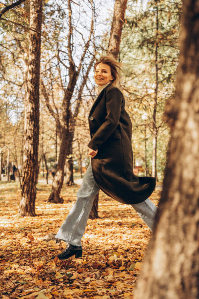 istock Beautiful woman enjoying autumn 1430783499