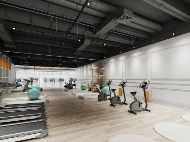 istock Small gym design with treadmills and exercise bikes in black and white. 1430784734