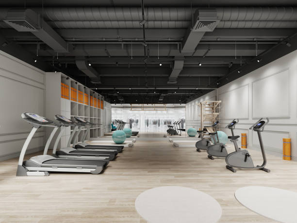 istock Small gym design with treadmills and exercise bikes in black and white. 1430784738