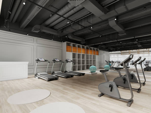 istock Small gym design with treadmills and exercise bikes in black and white. 1430784745