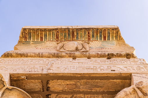 Kom Ombo, Aswan, Egypt. Upward view of a painted eave at the Kom Ombo temple.