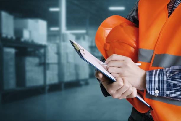 istock Builder makes reconciliation of goods in a warehouse. 1430791257