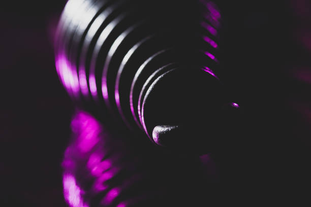 An old corkscrew on a cork background. Vintage style.