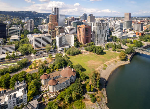 Downtown Portland on a sunny day with giant buildings and green surfaces stock photo