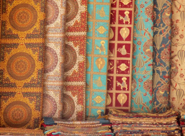 oriental patterns on materials for pillows and bedspreads - antique furniture old old fashioned imagens e fotografias de stock