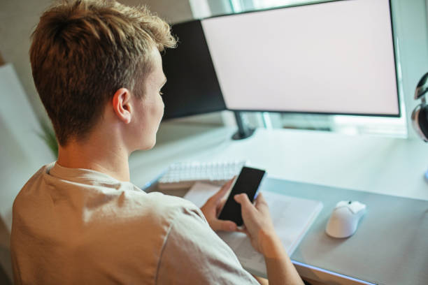 istock Teenager Boy Using a Mobile Phone 1430797882